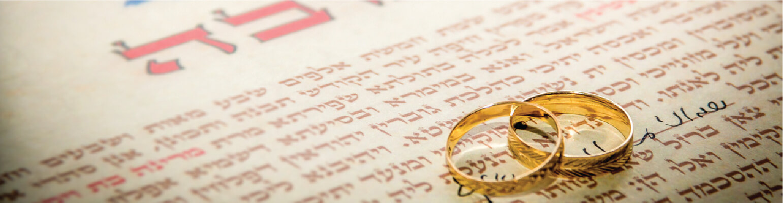 2 rings on a paper with hebrew writing